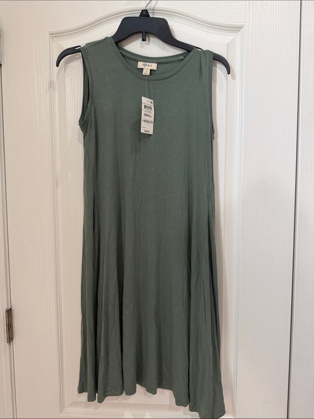 Style and the company size small 
Sleeveless Swing Dress — Olive Green NWT